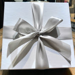 Load image into Gallery viewer, An image of a white gift box with silver ribbon
