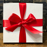 Load image into Gallery viewer, An image of a white gift box with red ribbon
