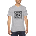 Load image into Gallery viewer, Men&#39;s heather - A man wearing a tshirt with a black letterpress chocolate logo
