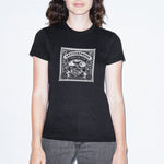 Load image into Gallery viewer, Women&#39;s black - a woman wearing a tshirt with a white letterpress chocolate logo
